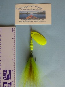 One of our handcrafted Red-n-Chartreuse French Blade Inline spinners with dressed bucktail treble size 2 from VMC. We like this one for the red highlight flash of deertail hock hair.